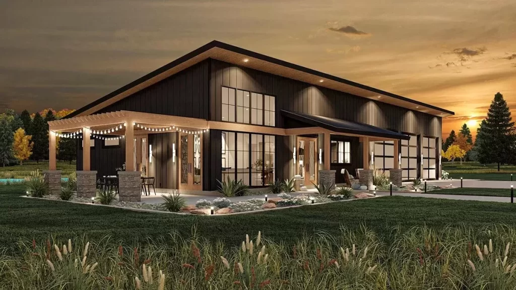 barndominium at night with outdoor patio