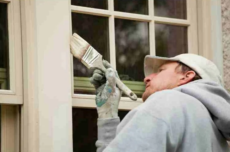 homeowner touching up paint
